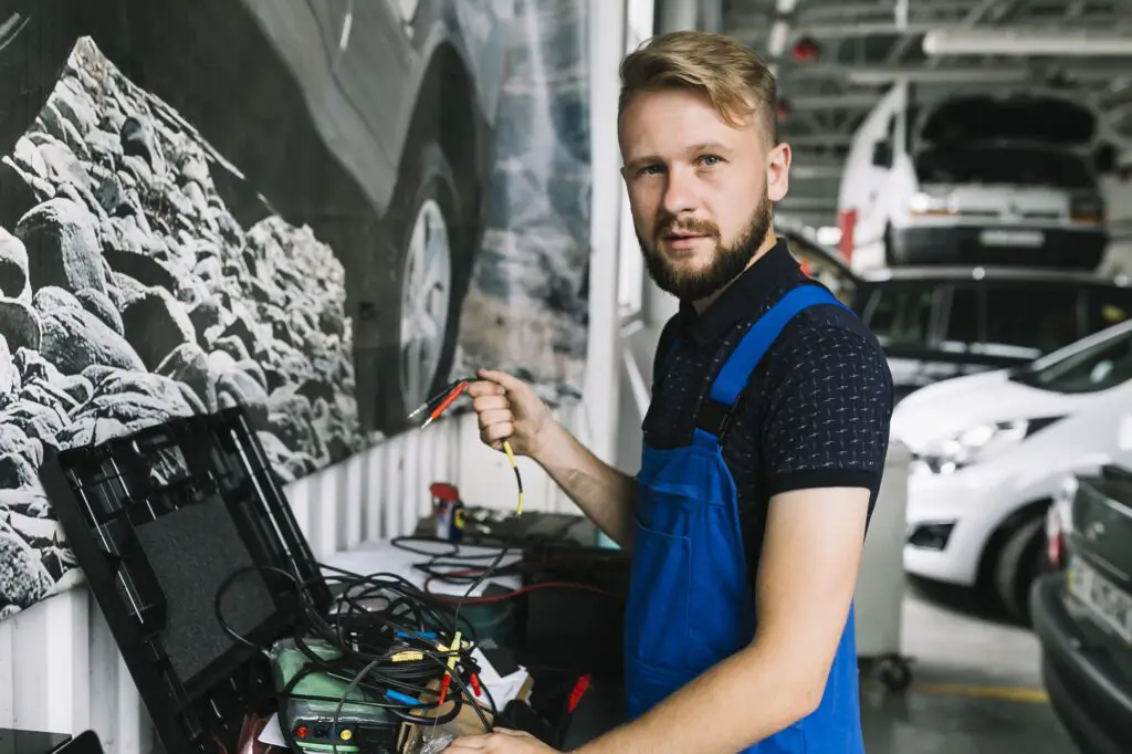 mechanic-working-with-wires-workshop